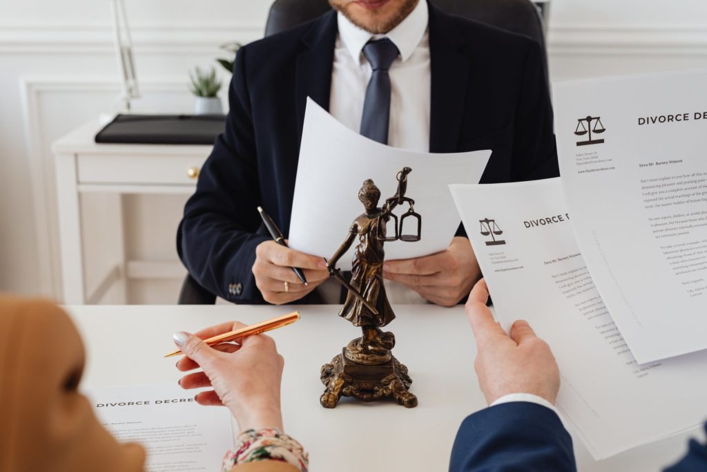 a man holding a paper and a pen