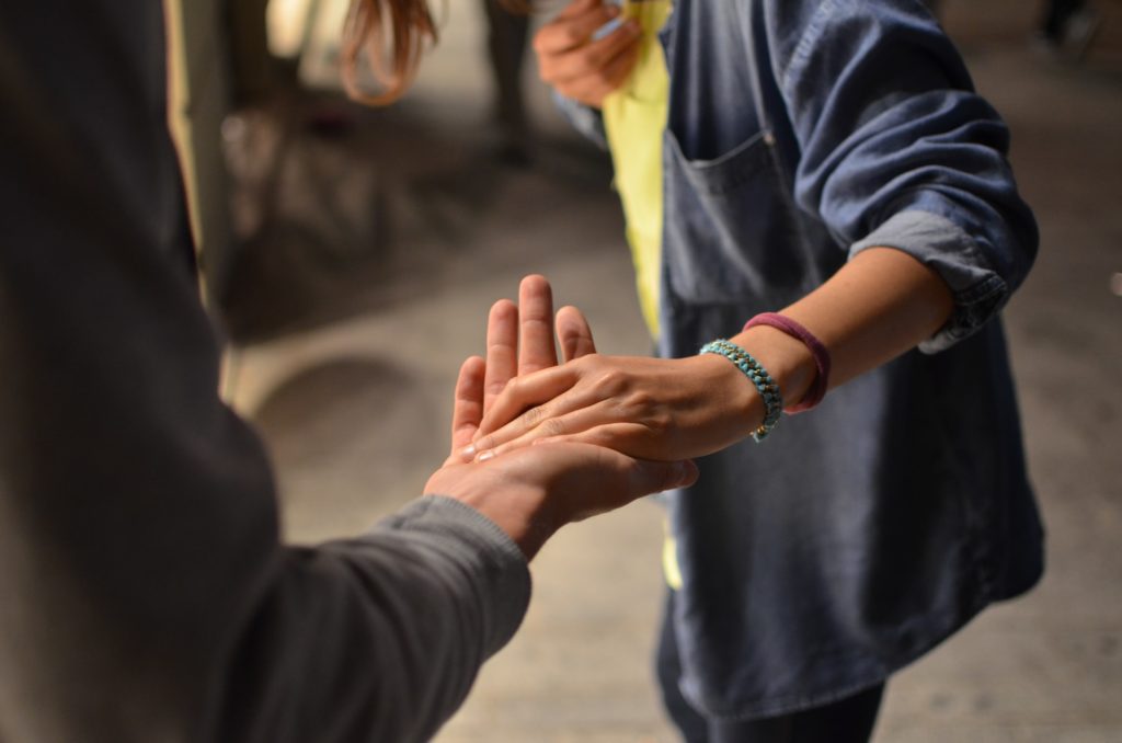 a man and woman holding hands