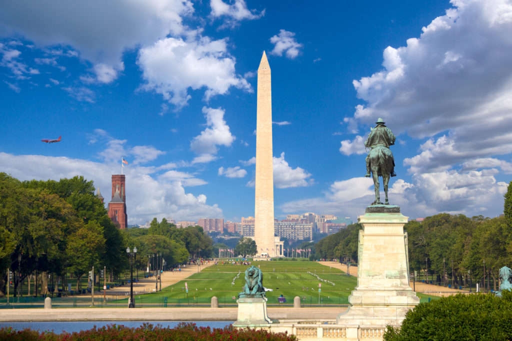 a statue in front of a monument