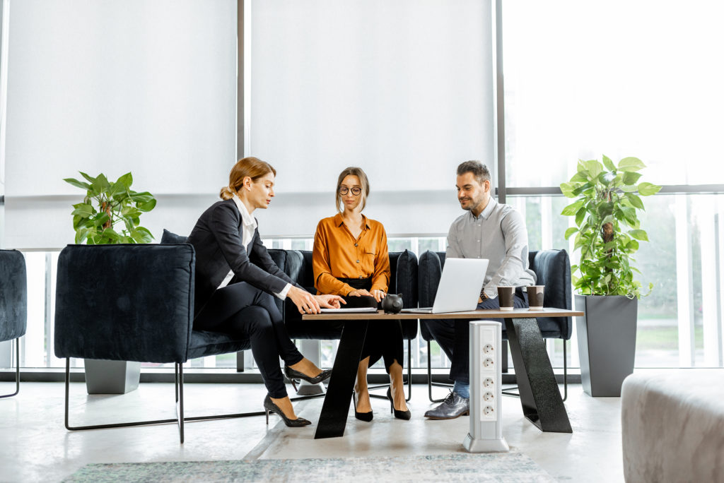 a group of people sitting on a couch