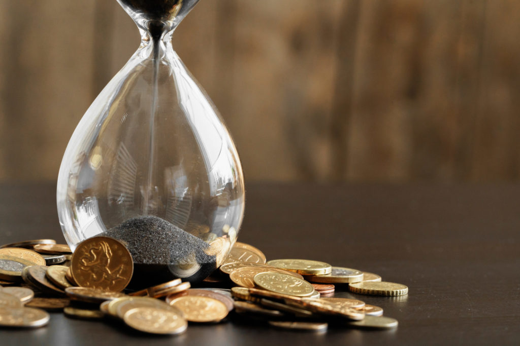 a glass of water and coins